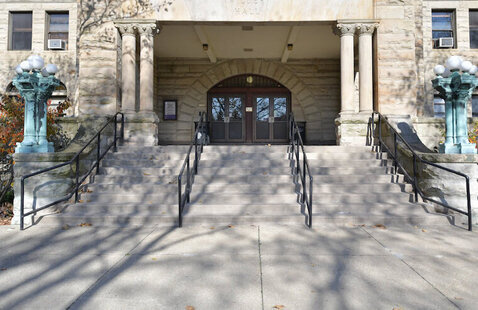 Steps up to an arch - the front entrance of Wilder Hall