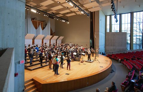 King Concert Hall with performers on stage, side view