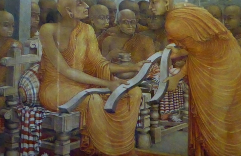 This image was originally posted to Flickr by Anandajoti at https://flickr.com/photos/ Buddhaghosa with three copies of Visuddhimagga, Kelaniya Raja Maha Vihara. From Wikicommons. 64337707@N07/20442865375