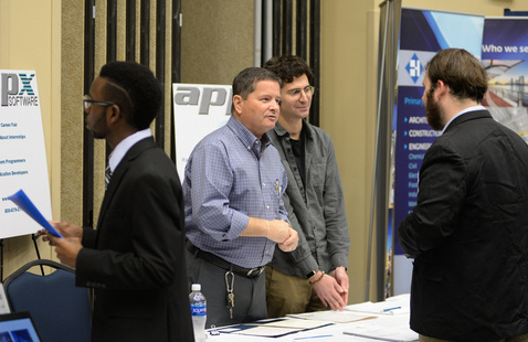 People talking at a career event 