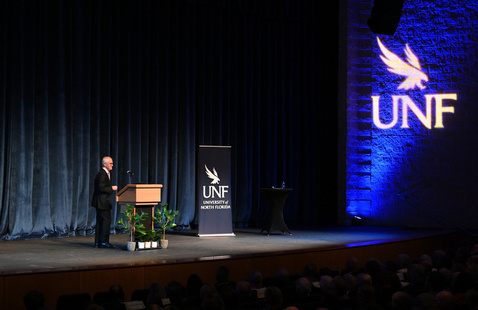 Speaker standing at podium
