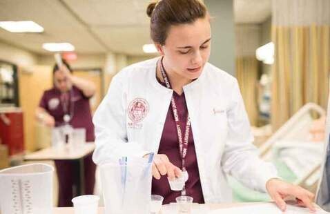 Female Nursing student in a lab