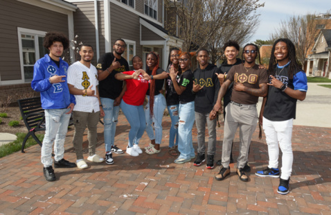 a group of NPHC men in the greek village