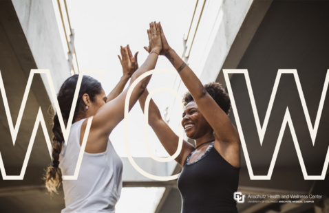 two women high fiving