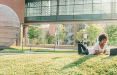 Person laying on grass