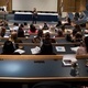 A presenter speaks in the amphitheater