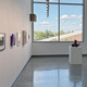 Paintings, photographs and sculpture are on display in the gallery.