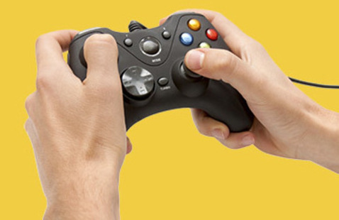 Closeup on a pair of hands holding a generic video game controller