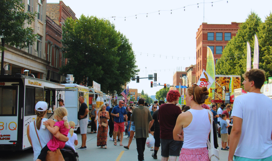 Crowd of people enjoying street fair on 3rd Street downtown