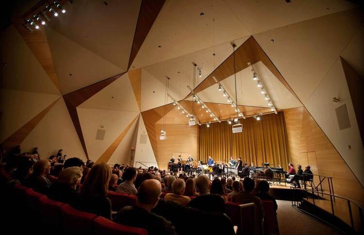 Orchestra playing inside Conrad Prebys Music Center
