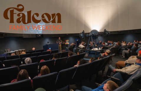 guests gathered in the planetrium for family weekend