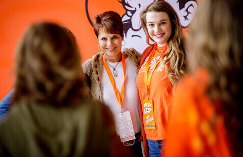 Student and mom posing for photo at OSU Up Close event