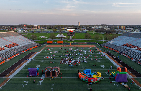 Doyt L Perry Stadium with students watching a movie outside