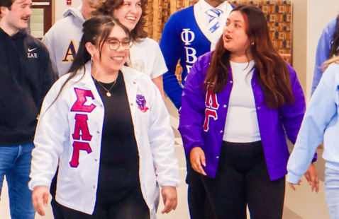 2 students in the MGC community walking around