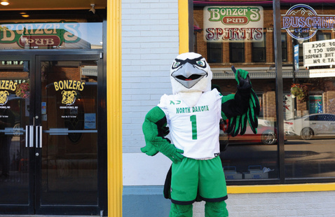 Fighting Hawk standing in front of Bonzer's