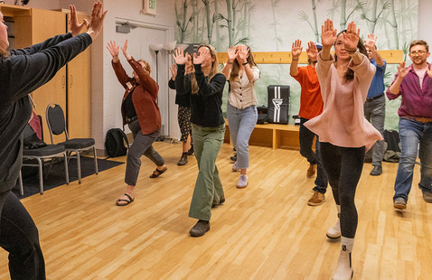 Picture of students in class doing strikes in the air