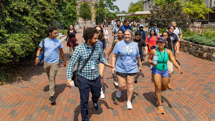 A member of Library staff leads students on a campus tour.