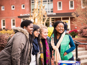 Fallfest attendees pose with Marcella Runnell, Family and Friends weekend.