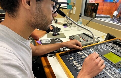 Student utilizing a soundboard