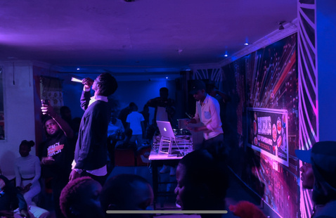 modern music concert with dj and african male singing