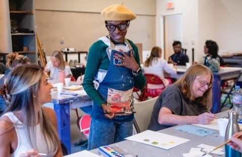 Art student standing at table