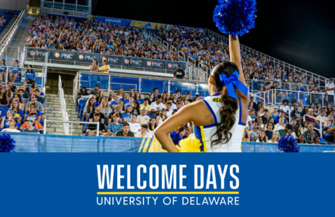 cheerleader performing for crowd of students