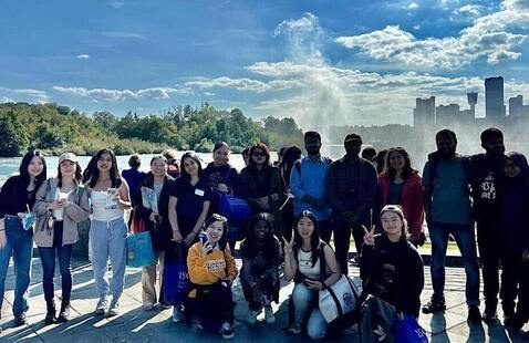 students standing in front of Niagara Falls.