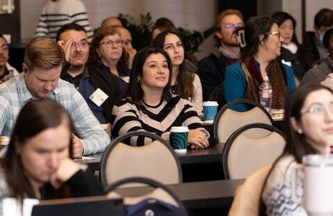 Attendees listen intently to a presentation at PANAO 2025