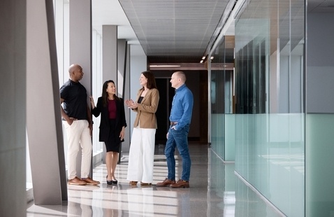 EMBA Students in Talking in Hallway
