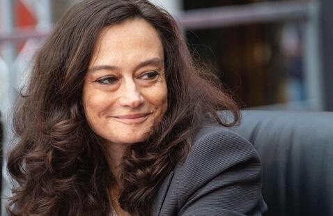 woman wearing a gray suit