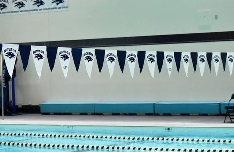 University of Nevada, Reno banner flags hang over the Lombardi Pool.