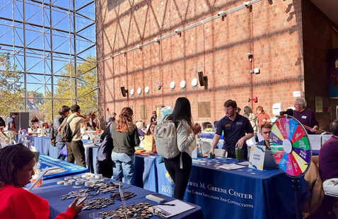 students visiting tables at resource fair.