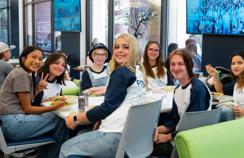 Students sitting at a table.