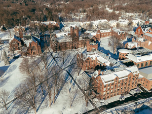 Aerial view of Mount Holyoke campus in winter, covered in snow.