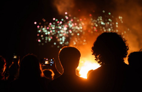 Two people looking out at the UNT Bonfire