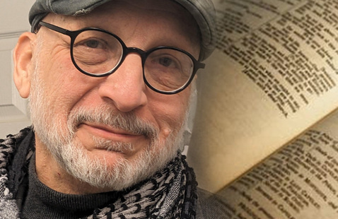 Dan Decker in front of a book displaying "Romeo & Juliet"