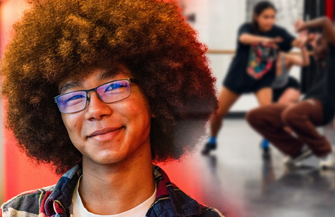 Brandon in front of a group of dancers.