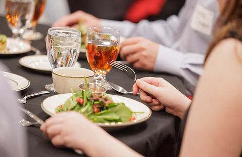 Salad on dinner plate at etiquette dinner