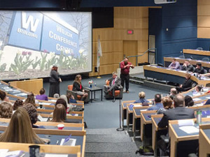 Attendees seated in a lecture hall during a career event