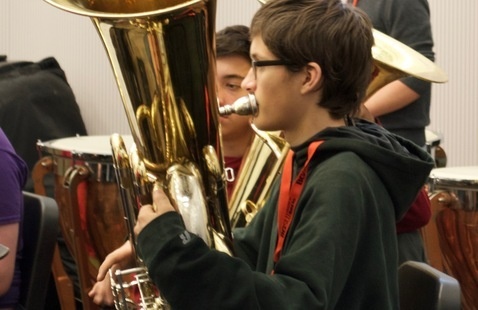 Honors Band student playing a tuba
