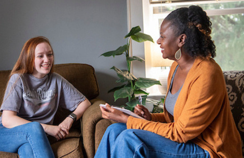 Counselor talking to a student in office