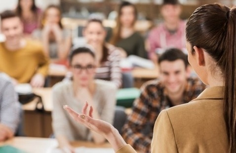teacher in front of a classroom of students