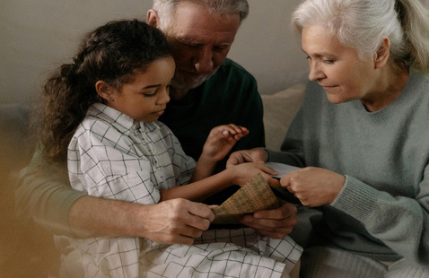 Elderly Couple Bonding with Their Grandchild