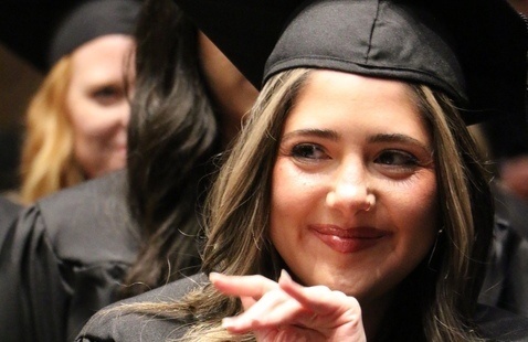 PA studies student smiles during graduation.
