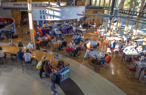 A photo of the Social House filled with students enjoying a meal 