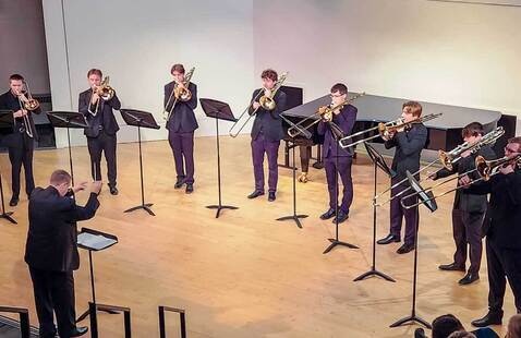 students playing trombones