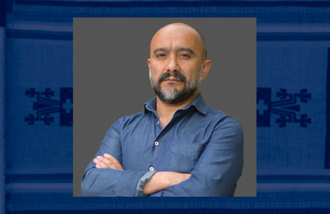 Juan Carlos Guerrero Hernández, Ph.D. over a faded textile background.