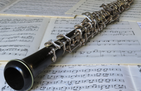 Oboe resting on sheet music