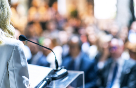 A speaker at a conference/ presentation.