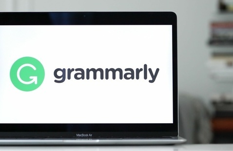 Photo of laptop with Grammarly logo on the screen